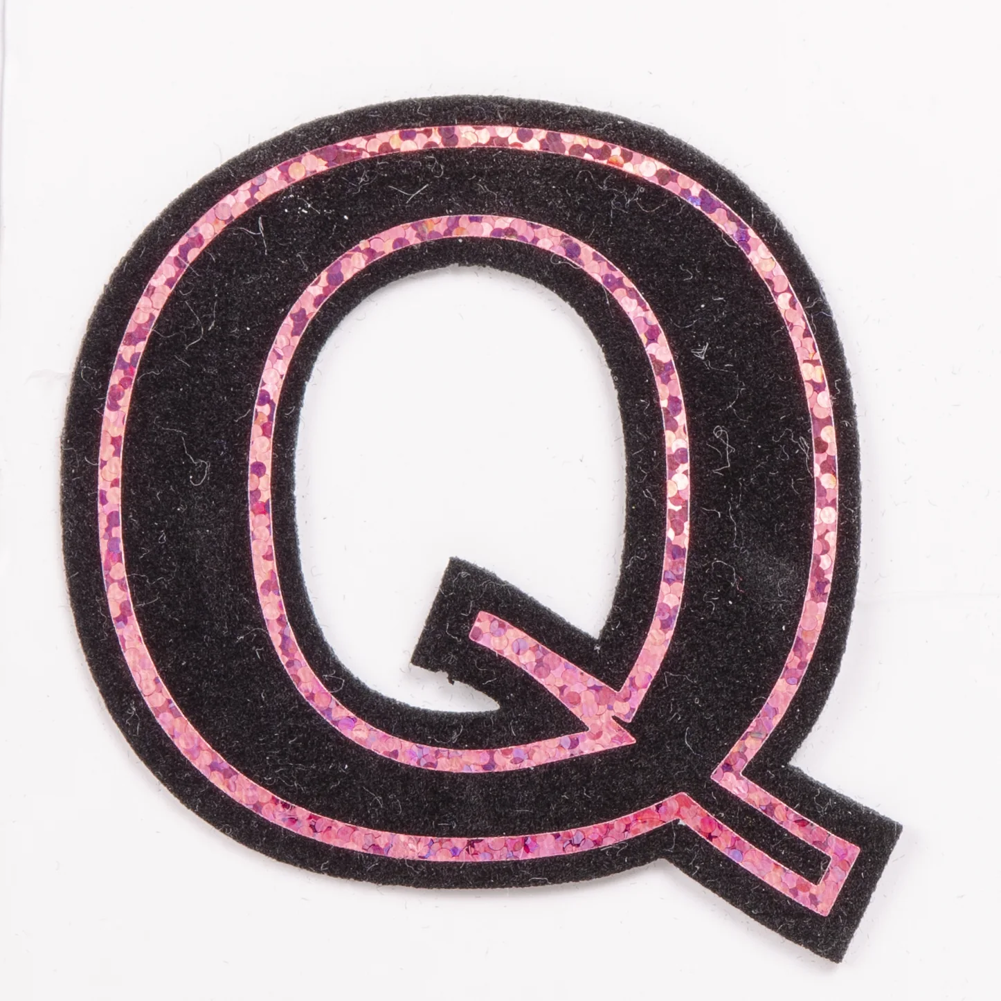 Laser-cut pink outline letter O patch