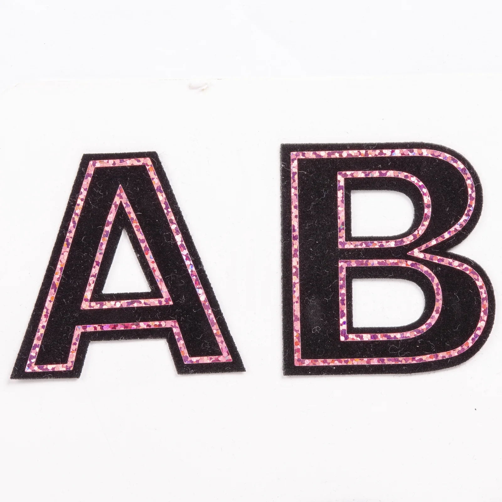 Black and pink outline letters for varsity jackets
